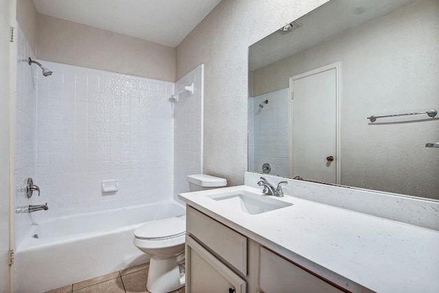 2109 Delvin Ln, Austin, TX 78728 - bathroom with bathtub / shower combination, toilet, vanity, tile patterned floors, and a textured wall