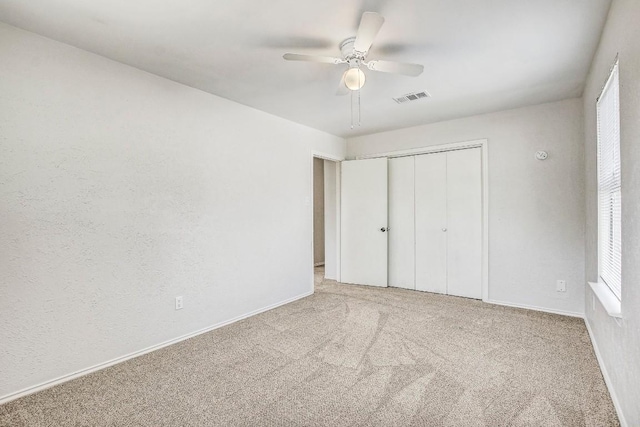 2109 Delvin Ln, Austin, TX 78728 - unfurnished bedroom featuring carpet floors, a closet, baseboards, and ceiling fan