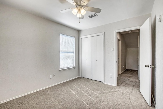 2109 Delvin Ln, Austin, TX 78728 - unfurnished bedroom featuring carpet flooring, baseboards, a closet, attic access, and a ceiling fan