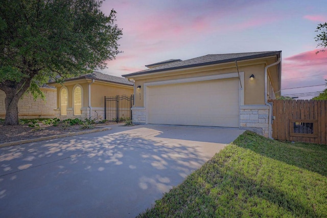 611 Algerita Dr, Georgetown, TX 78628 - ranch-style house with stone siding, stucco siding, and concrete driveway