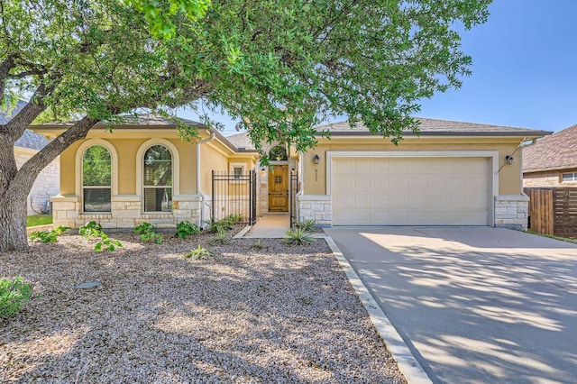 611 Algerita Dr, Georgetown, TX 78628 - view of front facade with stone siding, stucco siding, concrete driveway, and an attached garage