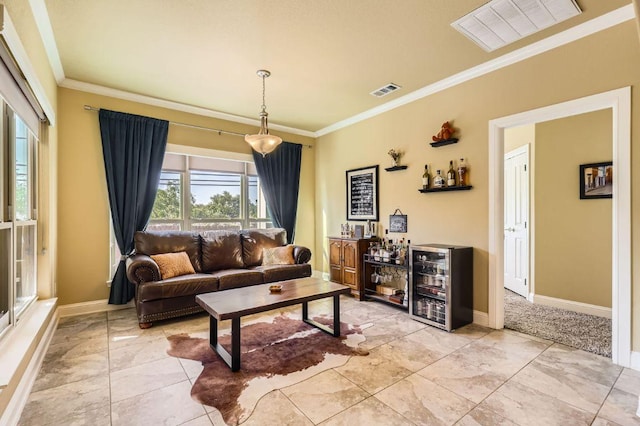 611 Algerita Dr, Georgetown, TX 78628 - living room featuring ornamental molding and a dry bar