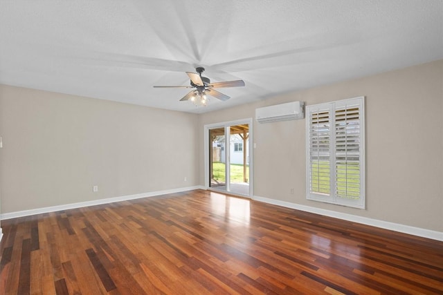 3504 Valley Pike Rd, Cedar Park, TX 78613 - spare room with a wall unit AC, ceiling fan, wood finished floors, and baseboards