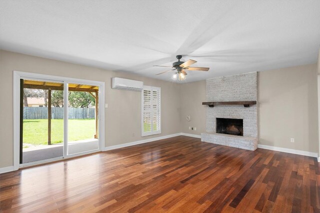 3504 Valley Pike Rd, Cedar Park, TX 78613 - unfurnished living room with a wall mounted AC, wood finished floors, ceiling fan, baseboards, and a fireplace