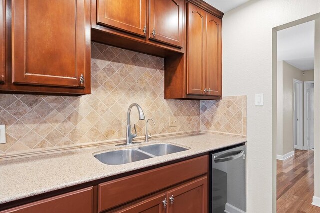 3504 Valley Pike Rd, Cedar Park, TX 78613 - kitchen featuring stainless steel dishwasher, a sink, baseboards, wood finished floors, and tasteful backsplash