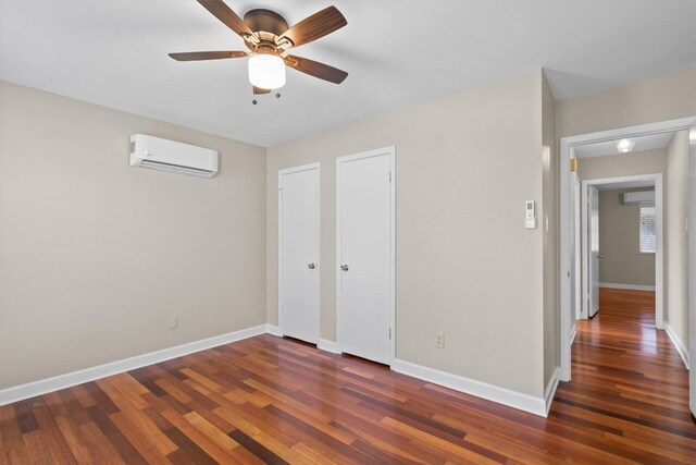 3504 Valley Pike Rd, Cedar Park, TX 78613 - unfurnished bedroom with a wall mounted AC, wood finished floors, baseboards, a ceiling fan, and a wall unit AC