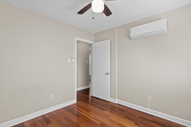 3504 Valley Pike Rd, Cedar Park, TX 78613 - spare room with a wall mounted air conditioner, a ceiling fan, baseboards, and wood finished floors