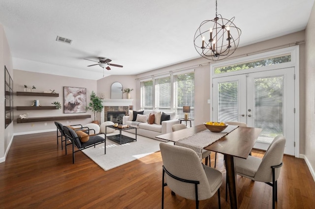 interior space with french doors, a notable chandelier, and visible vents