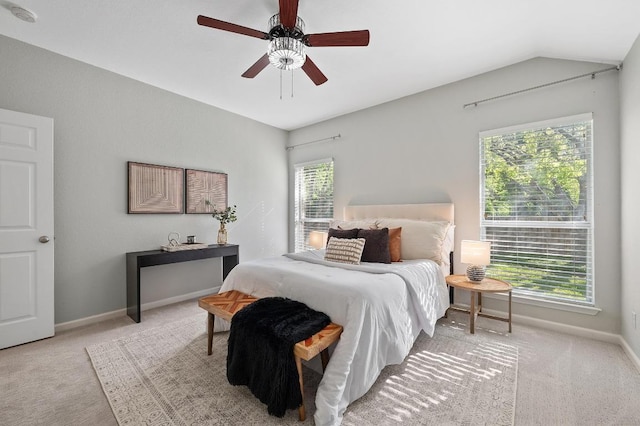 carpeted bedroom featuring baseboards, a ceiling fan, and lofted ceiling