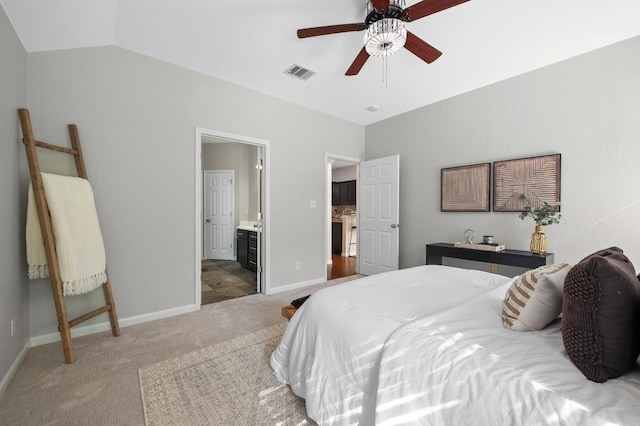 bedroom featuring visible vents, baseboards, carpet flooring, and vaulted ceiling