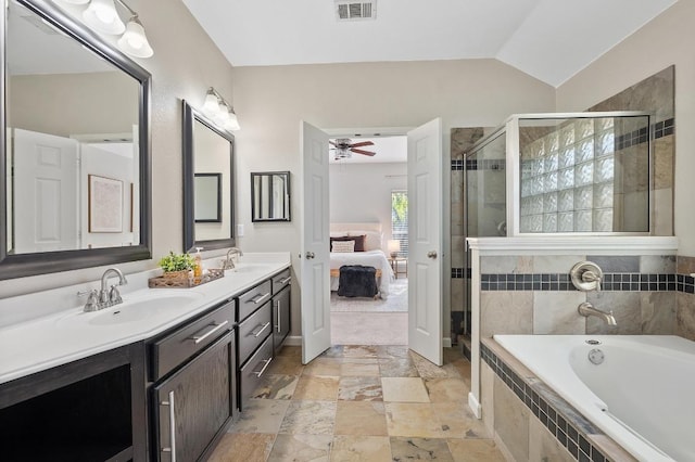 ensuite bathroom featuring a sink, visible vents, double vanity, and connected bathroom