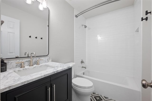 bathroom featuring toilet, vanity, and bathtub / shower combination
