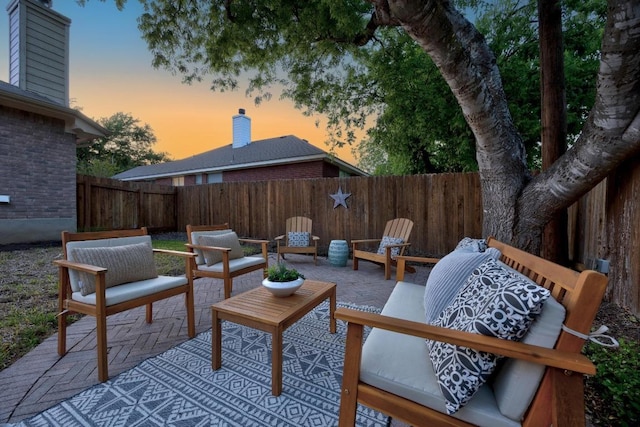 view of patio with a fenced backyard and outdoor lounge area