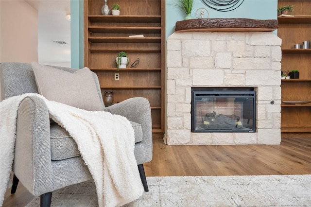 11134 Bonham Ranch Rd, Dripping Springs, TX 78620 - living room with wood finished floors and a stone fireplace