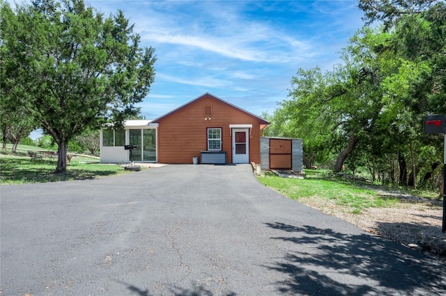 11134 Bonham Ranch Rd, Dripping Springs, TX 78620 - view of front of property featuring a sunroom and asphalt driveway