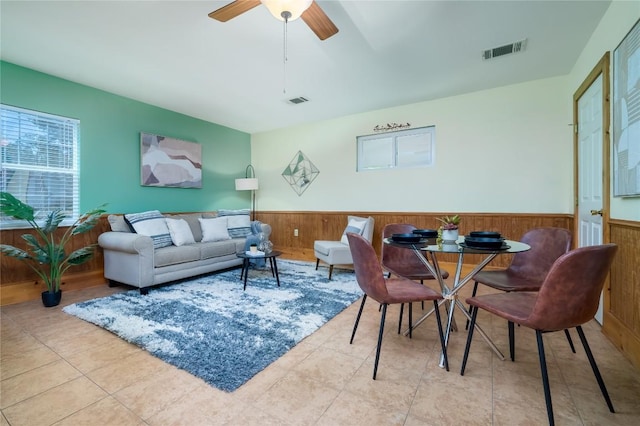 11134 Bonham Ranch Rd, Dripping Springs, TX 78620 - tiled living room featuring wainscoting, wood walls, and ceiling fan