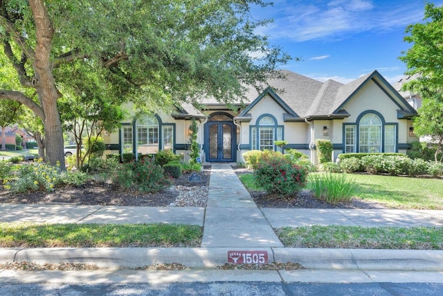 1505 Lake Forest Cv, Round Rock, TX 78665 - view of front of home featuring french doors and stucco siding