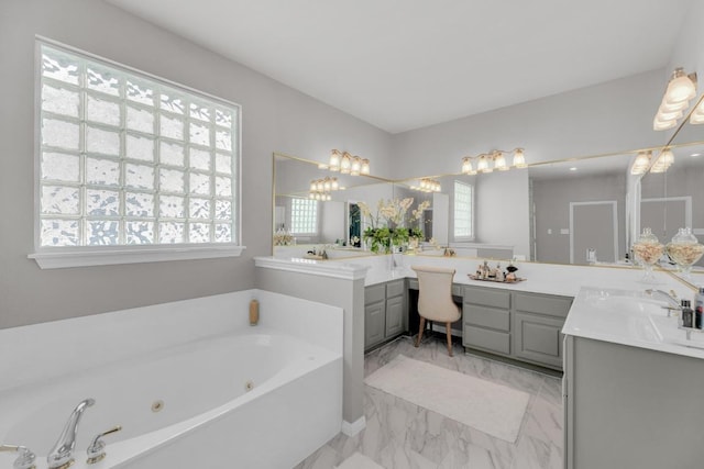 1505 Lake Forest Cv, Round Rock, TX 78665 - full bathroom with marble look tiles, two vanities, and a jetted tub