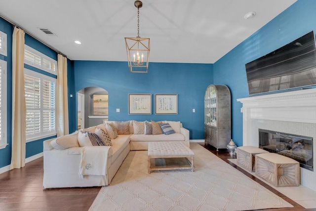 1505 Lake Forest Cv, Round Rock, TX 78665 - living room featuring arched walkways, wood finished floors, baseboards, a chandelier, and recessed lighting