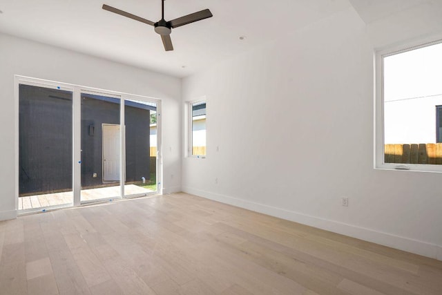 unfurnished room with light wood-style floors, baseboards, and ceiling fan