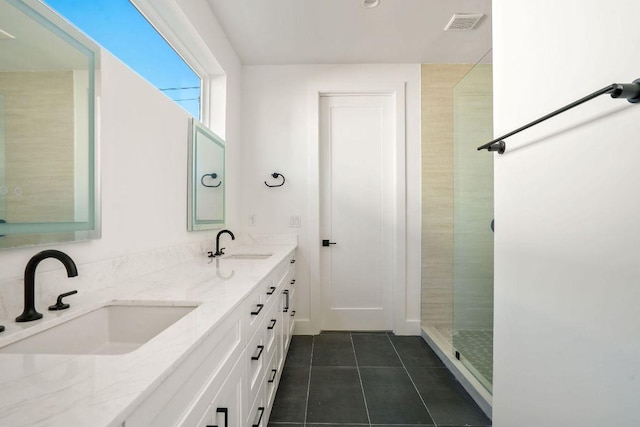 full bathroom with tile patterned floors, double vanity, a sink, and visible vents