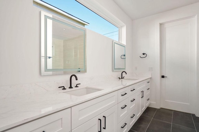 bathroom with a sink, tile patterned floors, and double vanity
