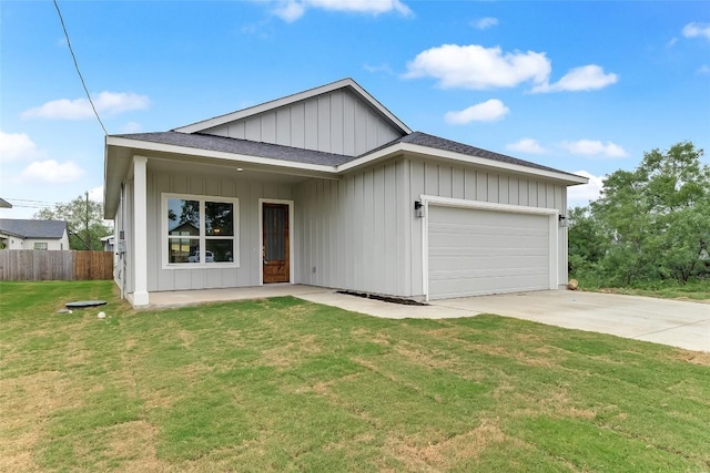 652 Aspen Ln, Cottonwood Shores, TX 78657 - view of front facade with board and batten siding, a garage, concrete driveway, and a shingled roof