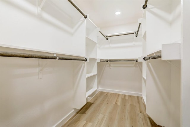 6007 Belfast Dr, Austin, TX 78723 - walk in closet featuring wood finished floors