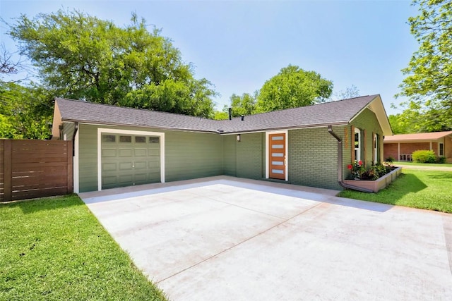 6007 Belfast Dr, Austin, TX 78723 - view of front of house with a garage, driveway, and brick siding