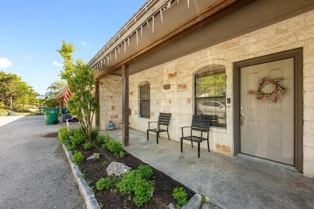 201 Loving Trl, Dripping Springs, TX 78620 - view of exterior entry with stone siding