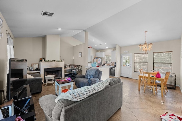 201 Loving Trl, Dripping Springs, TX 78620 - living area featuring a chandelier, lofted ceiling, light tile patterned flooring, and a fireplace