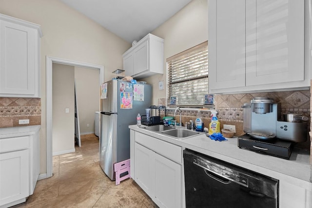 201 Loving Trl, Dripping Springs, TX 78620 - kitchen featuring a sink, black dishwasher, freestanding refrigerator, white cabinetry, and light countertops