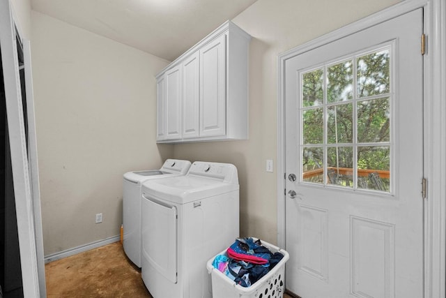 201 Loving Trl, Dripping Springs, TX 78620 - laundry area featuring independent washer and dryer, cabinet space, healthy amount of natural light, and baseboards