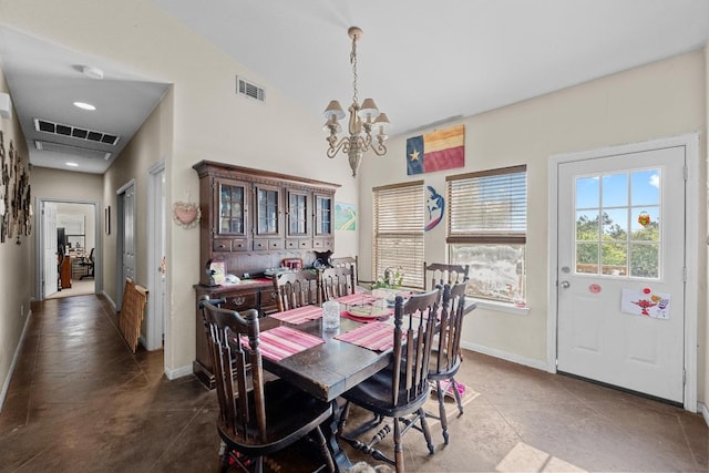 201 Loving Trl, Dripping Springs, TX 78620 - dining room with a chandelier, baseboards, dark tile patterned flooring, and lofted ceiling