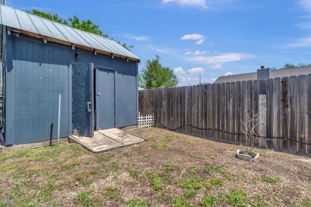 view of shed featuring a fenced backyard