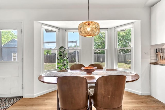 206 Quail Cir, Hutto, TX 78634 - dining space with light wood-style floors and baseboards