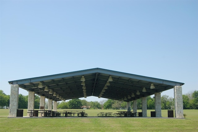 view of home's community with a yard