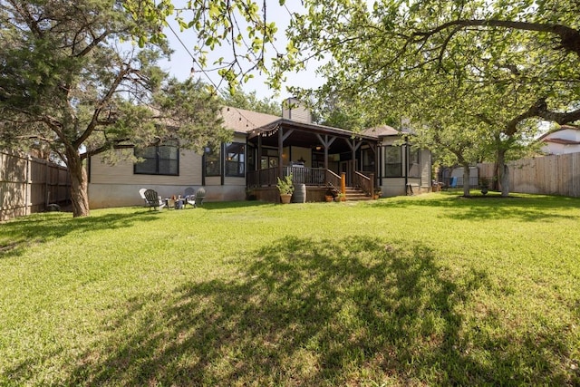 7303 Bluntleaf Cv, Austin, TX 78750 - rear view of property with a sunroom, a fenced backyard, and a chimney