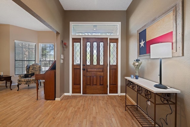 7303 Bluntleaf Cv, Austin, TX 78750 - entryway with light wood-style flooring and baseboards
