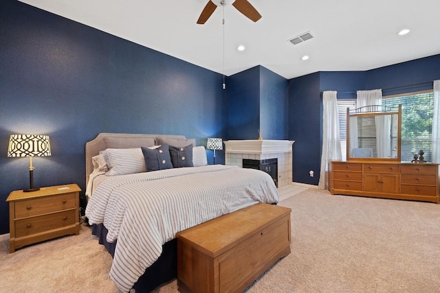 7303 Bluntleaf Cv, Austin, TX 78750 - bedroom featuring carpet flooring, ceiling fan, recessed lighting, and a tile fireplace
