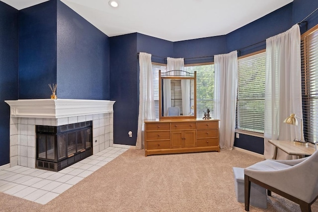 7303 Bluntleaf Cv, Austin, TX 78750 - carpeted living area featuring a tiled fireplace and baseboards