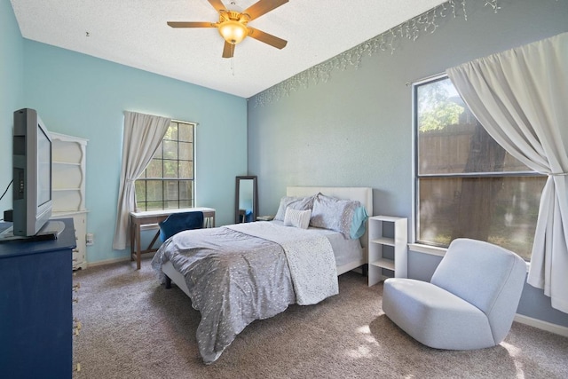 7303 Bluntleaf Cv, Austin, TX 78750 - carpeted bedroom with a ceiling fan and a textured ceiling
