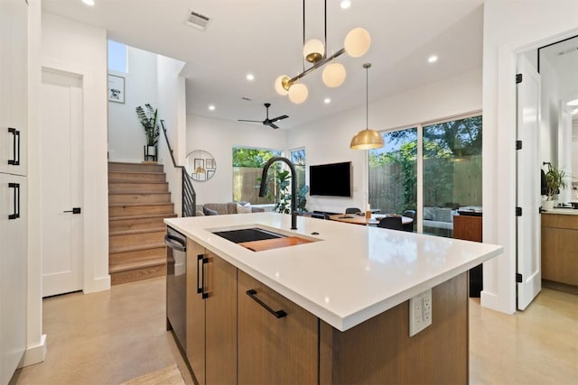 4907 Delores Ave, Austin, TX 78721 - kitchen featuring a sink, ceiling fan, concrete flooring, recessed lighting, and healthy amount of natural light