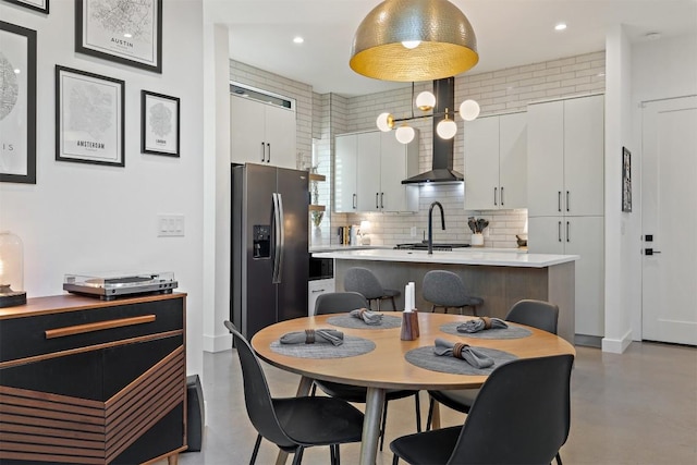 4907 Delores Ave, Austin, TX 78721 - dining area featuring finished concrete flooring and recessed lighting