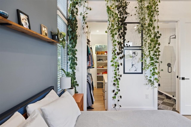 4907 Delores Ave, Austin, TX 78721 - bedroom with connected bathroom and multiple windows