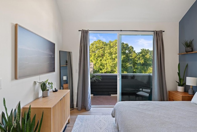 4907 Delores Ave, Austin, TX 78721 - bedroom with light wood-style floors and lofted ceiling
