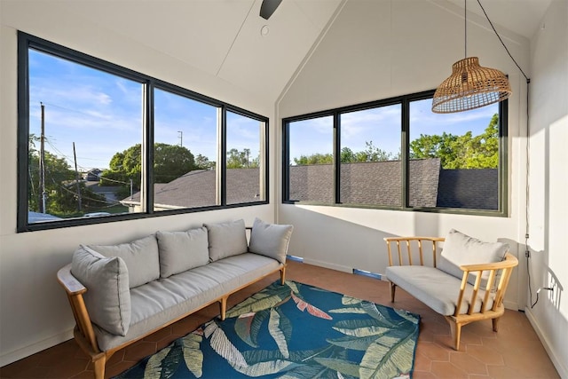 4907 Delores Ave, Austin, TX 78721 - sunroom featuring healthy amount of natural light, baseboards, tile patterned floors, and high vaulted ceiling