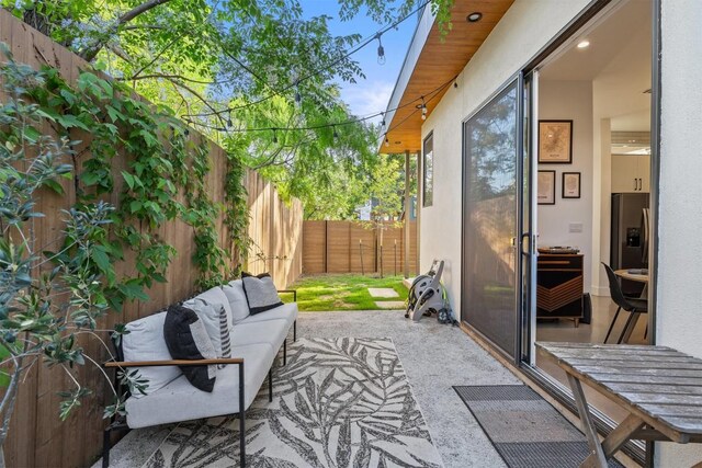 4907 Delores Ave, Austin, TX 78721 - fenced backyard featuring a patio area and an outdoor living space