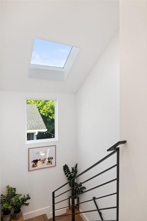 4907 Delores Ave, Austin, TX 78721 - staircase featuring a skylight