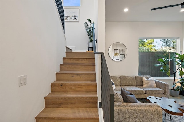 4907 Delores Ave, Austin, TX 78721 - stairway featuring a ceiling fan and recessed lighting
